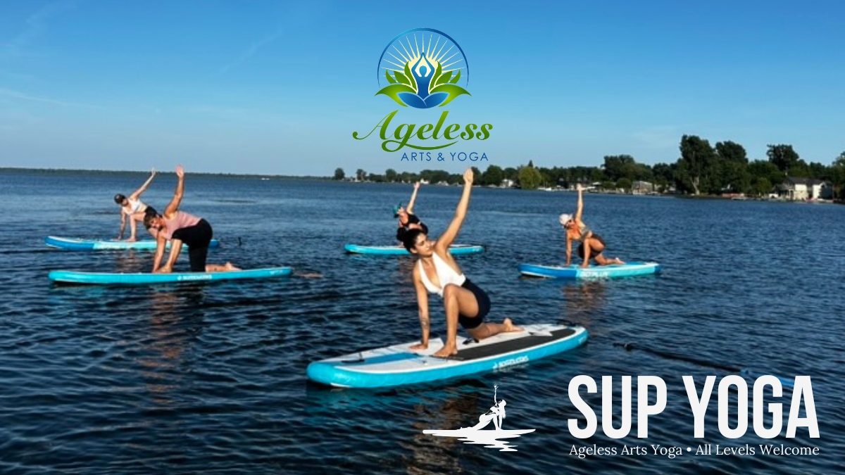 Group enjoying SUP Yoga with Ageless Arts Yoga on Rondeau Bay at Willow Barrel Resort